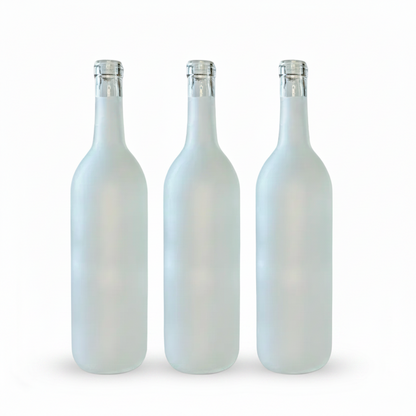 Three white bottles with silver caps on a white background