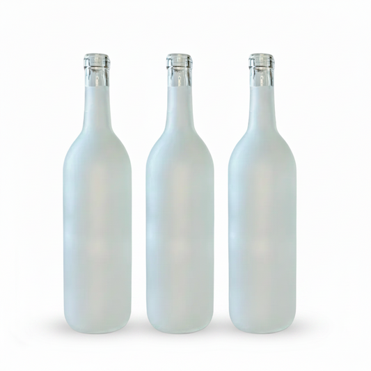 Three white bottles with silver caps on a white background