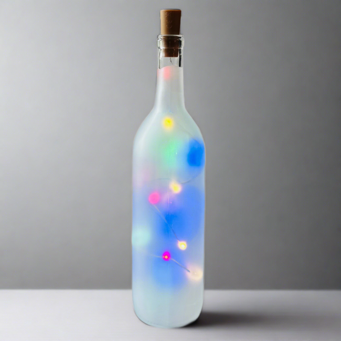 Frosted Wine Bottle With Colored Battery Operated Fairy Lights Powered From Cork