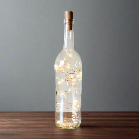 Clear Wine Bottle With Warm White Lights with Rustic Copper Wire Powered From Cork