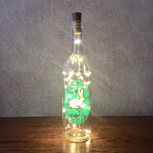 Load image into Gallery viewer, Easter Egg Vinyl Wine Bottle With Twinkle Fairy Lights Powered From Cork